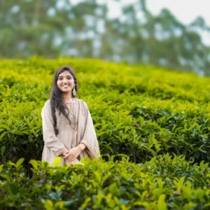 "Sahithi, founder of Yaami Sri Pickles, smiling in a traditional saree, representing the homemade and authentic essence of the brand."